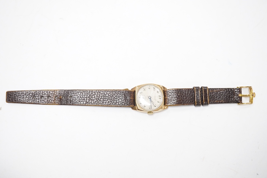 A gentleman's 1930's yellow metal Rolex manual wind wrist watch, retailed by Croydon & Sons, Ipswich, with Arabic dial and subsidiary seconds, the case back numbered 554 over 37665, case diameter 26mm, on a late associat